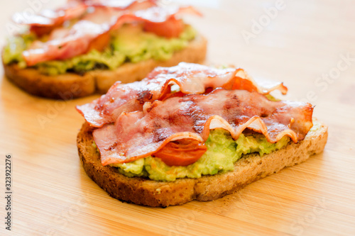 avocado toast with cherries tomatoes and bacon