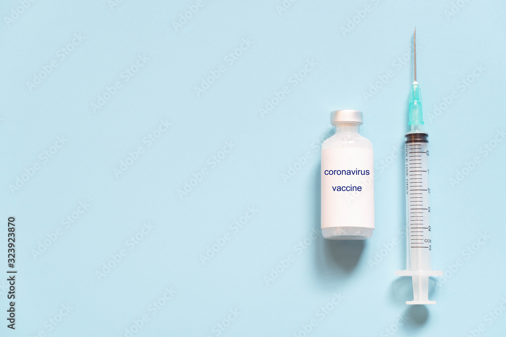Coronavirus vaccine vial with syringe for prevent coronavirus diesease (SARS, MERS and Covid-19) on light blue background. Virus pandemic protection concept. Copy space. Coronavirus vaccine vial with syringe for prevent coronavirus diesease (SARS, MERS and Covid-19) on light blue background. Virus pandemic protection concept. Copy space.