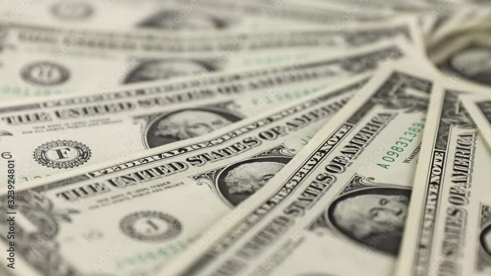 close-up of endless changing background with cash one american dollars moving, in the center of flat lay composition is a portrait of president George Washington, concept of business and finance close-up of endless changing background with cash one american dollars moving, in the center of flat lay composition is a portrait of president George Washington, concept of business and finance