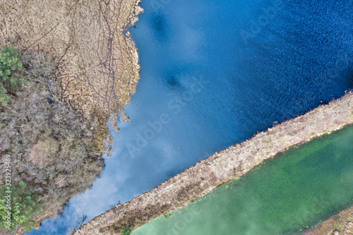 Abstract Aerial view of a lake in the German heath landscape, Vertical photo above the middle of the moor lake photo