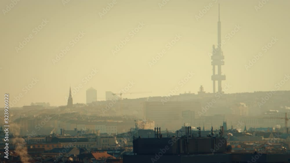 prague tv tower at sunrise wirh roofs and birds flying morning prague tv tower at sunrise wirh roofs and birds flying morning