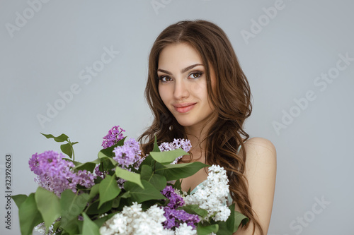 Portrait of the Woman with a Bouquet of Spring Flowers