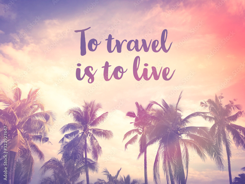 Obraz premium To travel is to live word on palm tree pink pastel sky background
