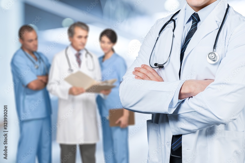 Young man doctor with stethoscope on medical team background Young man doctor with stethoscope on medical team background