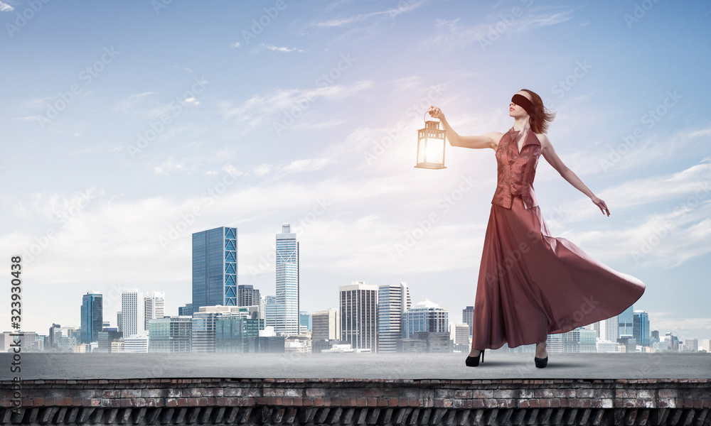 Attractive girl muse with old lantern in hand at summer day. Mixed media Attractive girl muse with old lantern in hand at summer day. Mixed media