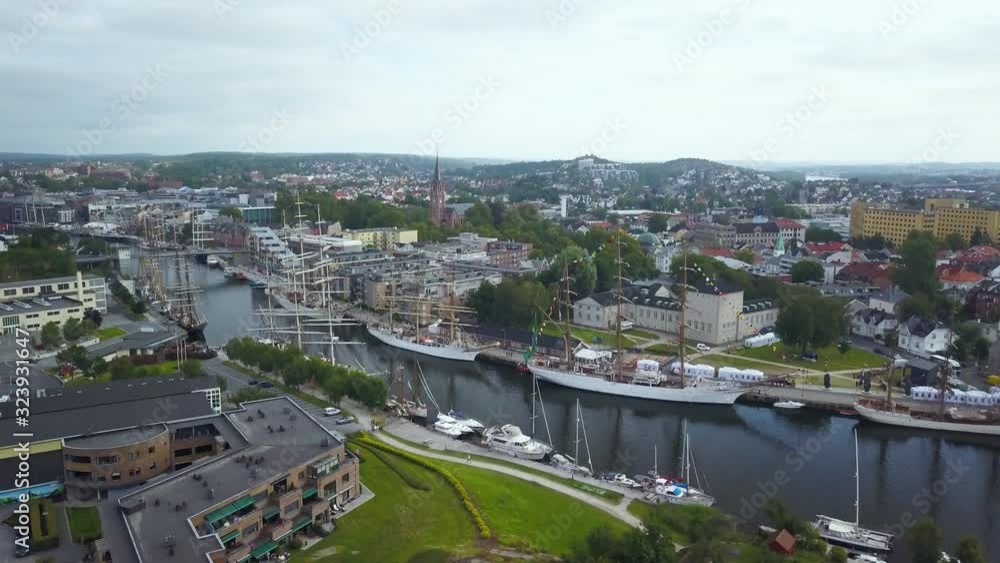 Unique aerial view of huge ships in tight canal during Tall Ship Race in Fredrikstad Unique aerial view of huge ships in tight canal during Tall Ship Race in Fredrikstad
