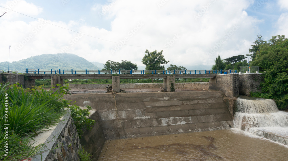 Dam divider river water flow. Modern irrigation methods so that irrigation of rice fields is fulfilled