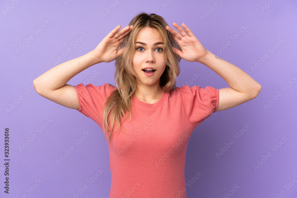 Teenager Russian girl isolated on purple background with surprise expression Teenager Russian girl isolated on purple background with surprise expression