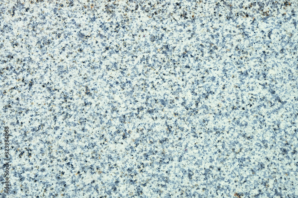 Light gray polished granite texture. Stone background Light gray polished granite texture. Stone background