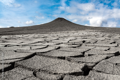 Cracked earth at the foot of a mud volcano