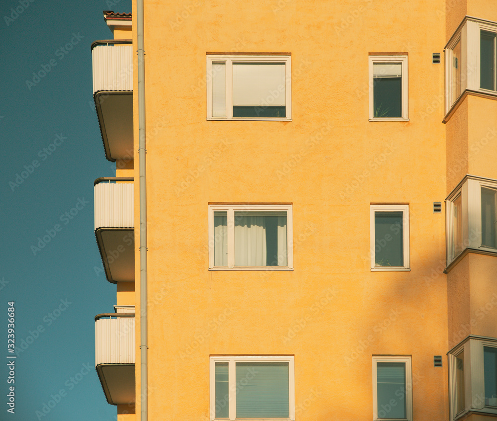 Yellow modern building on a clear day at sunset