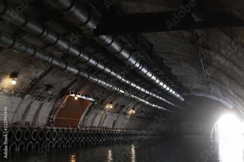 Glowing exit of concrete tunnel, photo