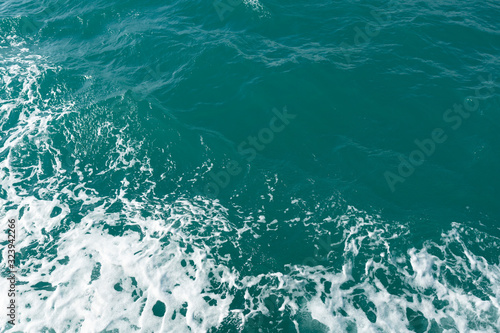 Blue water in the ocean or in the sea. Turquoise waves and Aqua Mente and Phantom Blue. Photos for wallpaper or for background. Abstraction of the waves. Thailand
