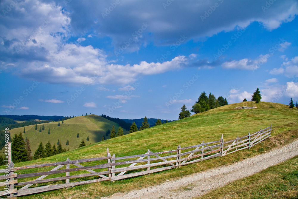 rural landscape with wooden fence and blue sky rural landscape with wooden fence and blue sky