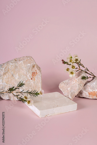 Pastel pink and white stone marble display set for product background decorate with white flower