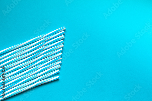  Straw of blue juice on a blue background