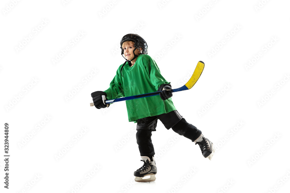 Little hockey player with the stick on ice court, white studio background. Sportsboy wearing equipment and helmet, practicing, training. Concept of sport, healthy lifestyle, motion, movement, action. Little hockey player with the stick on ice court, white studio background. Sportsboy wearing equipment and helmet, practicing, training. Concept of sport, healthy lifestyle, motion, movement, action.