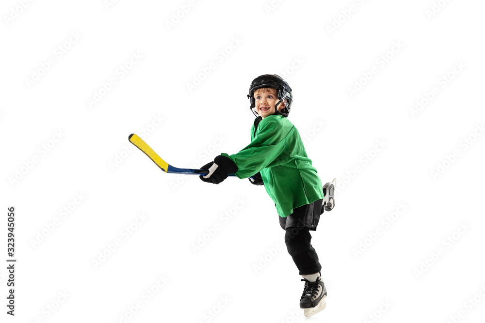 Little hockey player with the stick on ice court, white studio background. Sportsboy wearing equipment and helmet, practicing, training. Concept of sport, healthy lifestyle, motion, movement, action. Little hockey player with the stick on ice court, white studio background. Sportsboy wearing equipment and helmet, practicing, training. Concept of sport, healthy lifestyle, motion, movement, action.