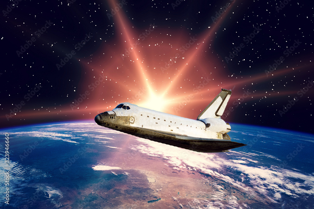 Fototapeta premium Shuttle above the planet earth. Space scene. The elements of this image furnished by NASA.