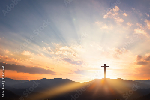 Good Friday concept: cross with sunset in the sky background photo