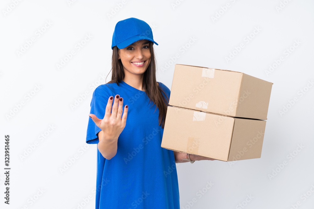 Young delivery woman over isolated white background inviting to come Young delivery woman over isolated white background inviting to come