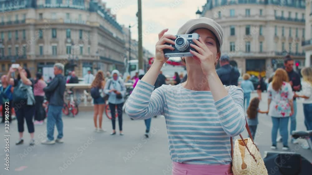 Attractive photographer taking photo in Paris, France Attractive photographer taking photo in Paris, France