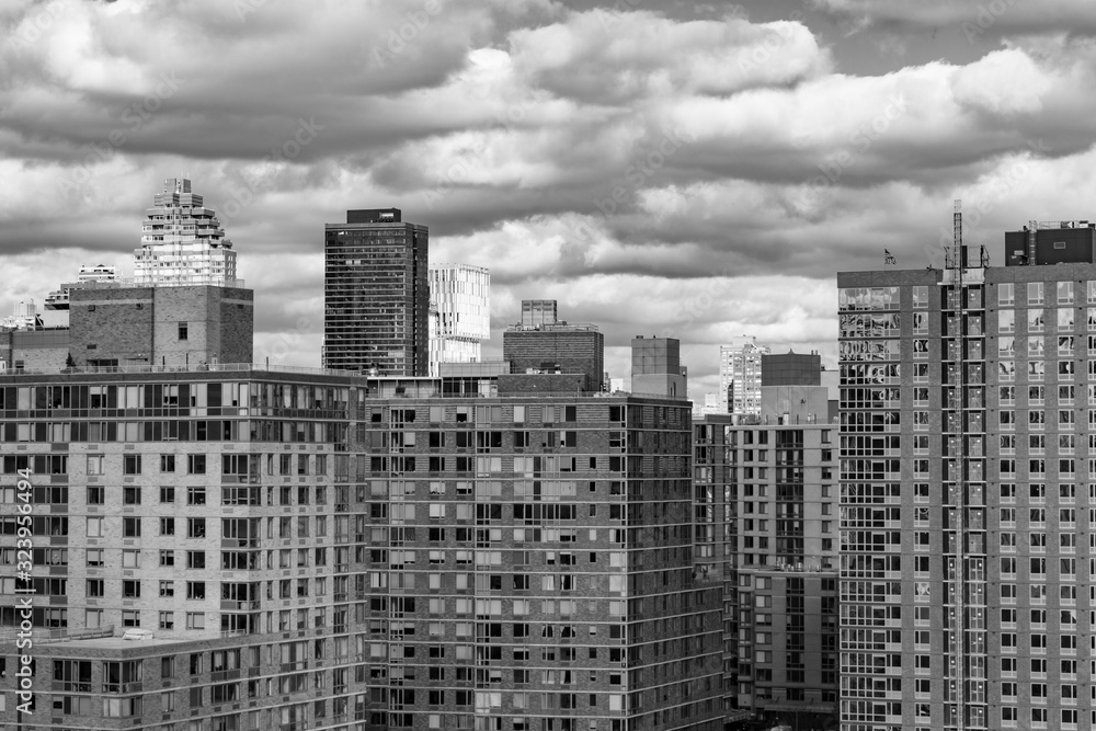 Black and White Photo with Roosevelt Island Skyscrapers in New York City with Clouds