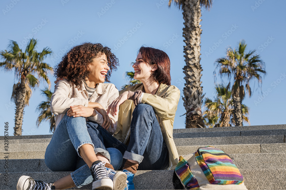 young multiracial couple women and laughing