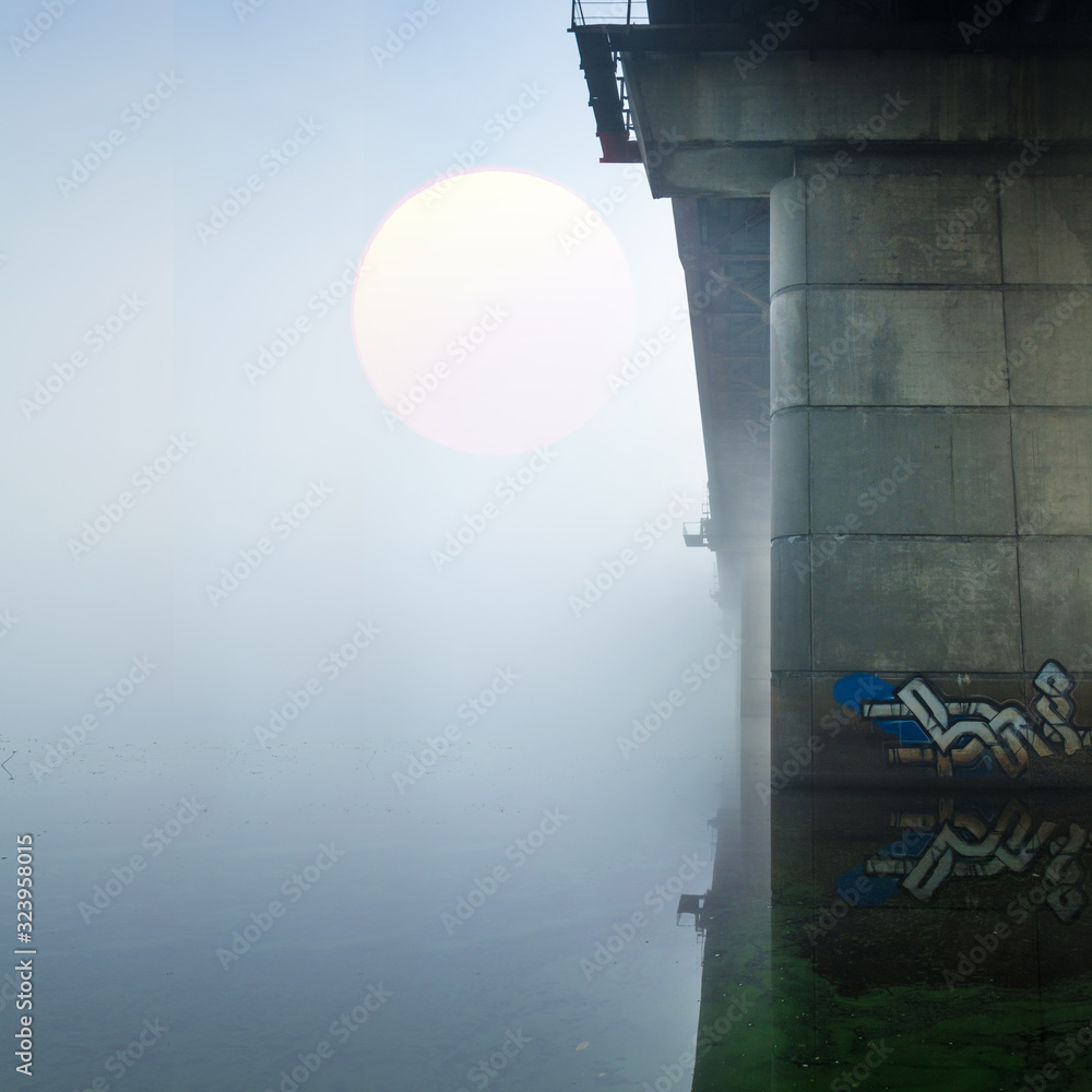 bridge over foggy river bridge over foggy river
