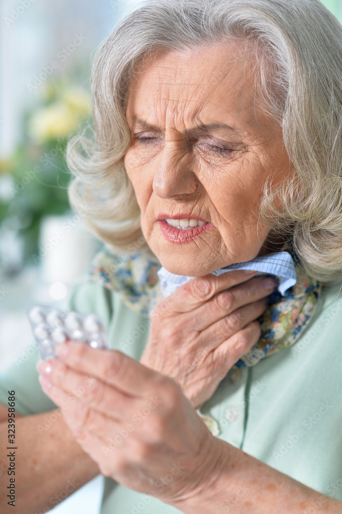 Close up portrait of sick senior woman sitting at table Close up portrait of sick senior woman sitting at table
