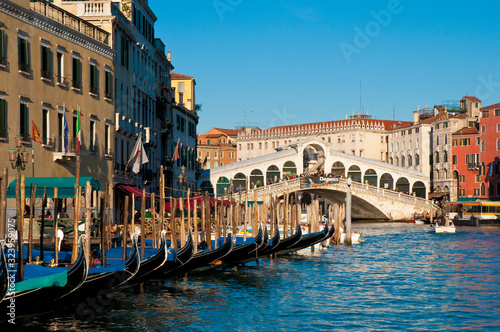 Gondolas at Rialto bridge across the Great Channel located at Venice, Italy