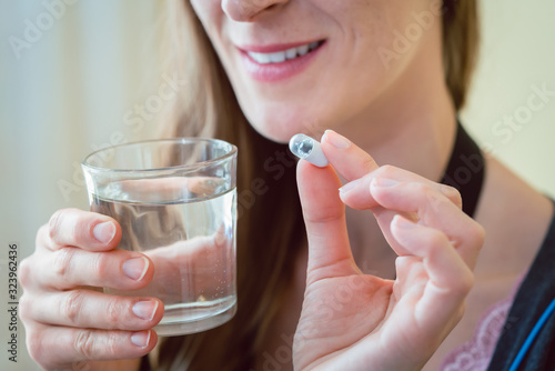 Photos Woman patient swallowing capsule endoscopy video pill