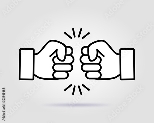 Bro fist bump power five pound on a gray background with soft shadow. photo