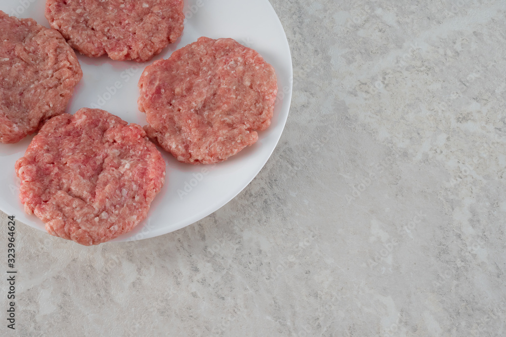 Steaks on a white plate, the concept of proper nutrition. Steaks on a white plate, the concept of proper nutrition.