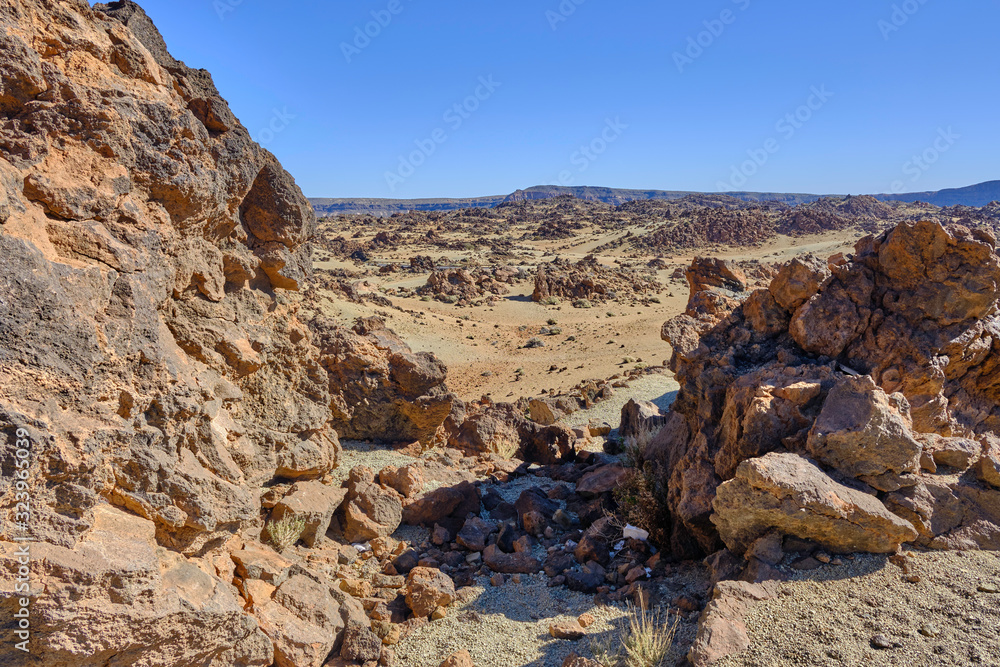 Scenic view of desert in Mount Teide national park (Parque Nacional del Teide) on Tenerife in Canary islands in Spain. Beautiful summer sunny look of wilderness on small tropical island near Africa