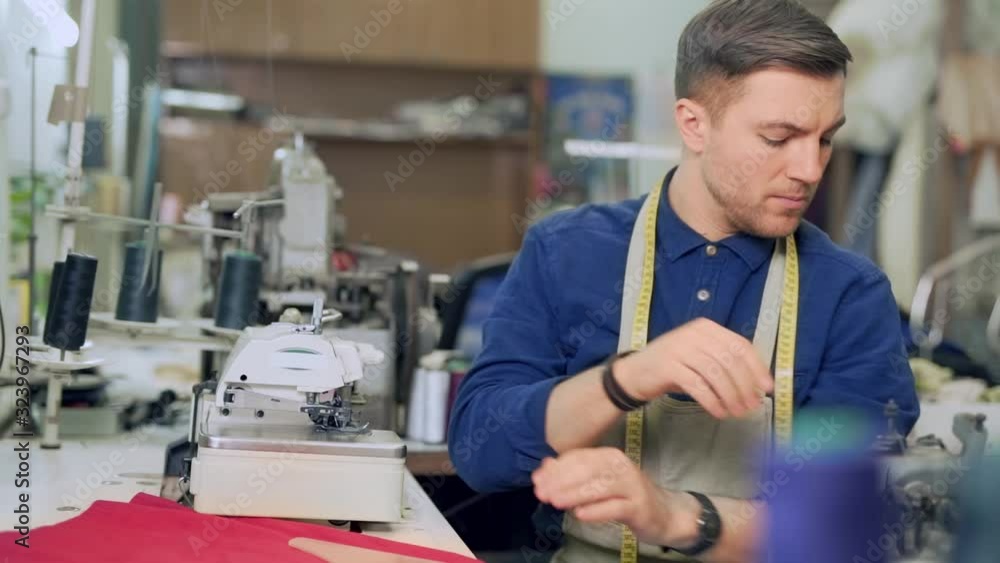 a clothing designer draws a new sketch a clothing designer draws a new sketch