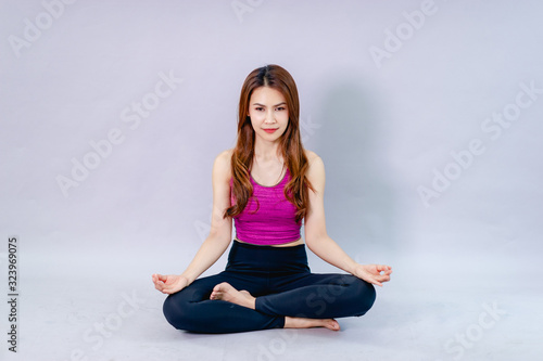 Women doing yoga for health Exercise in the room Concept of health care and good shape