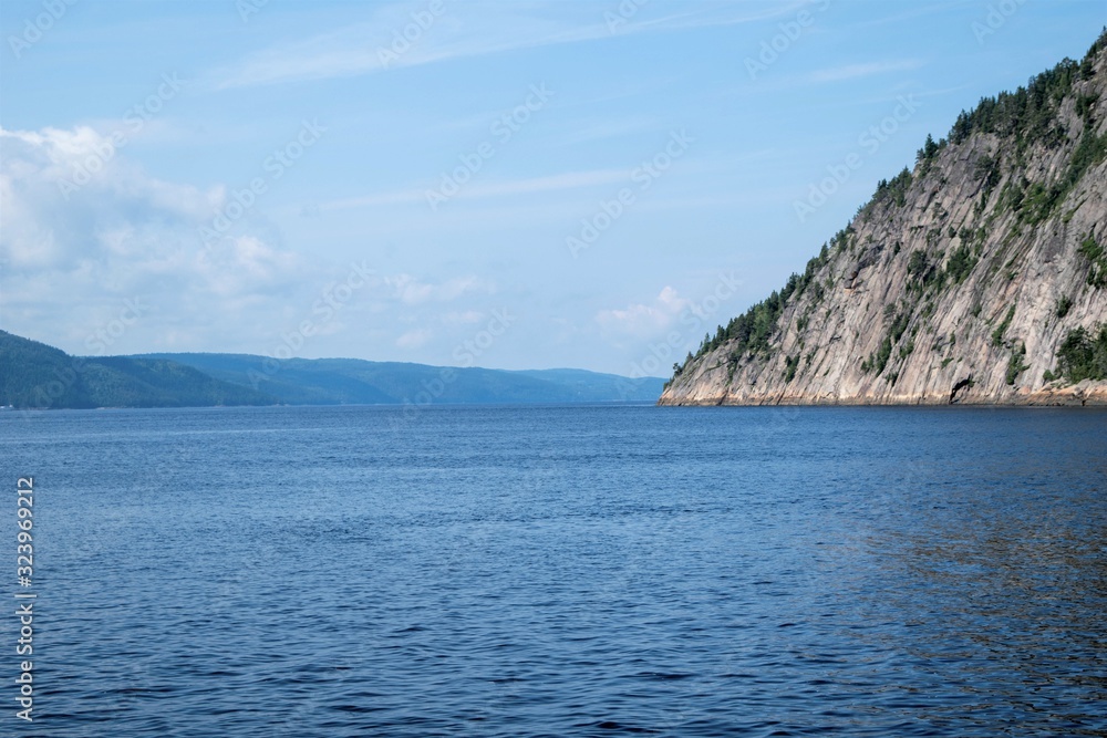 landscape photography of the Gaspé Peninsula in Quebec. Photograph of a lake with trees. Mountain with lake and trees
