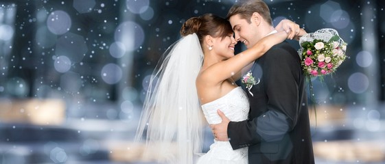 Happy just married young couple on bokeh background