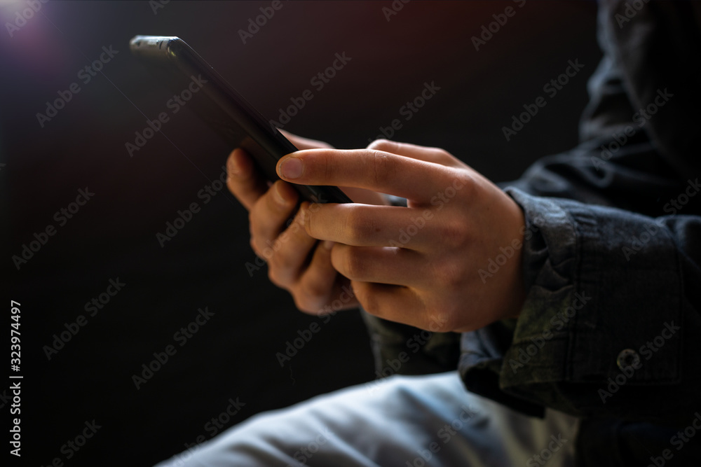 man holding tablet with lens flare , selective focus
