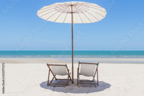 Idyllic tropical beach with white sand  turquoise ocean water and blue sky in huahin thailand
