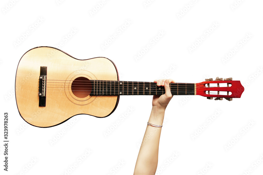 Fototapeta premium Guitar in a hand on a white background. Musical instrument