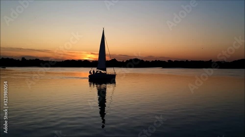 Yacht Sailing at Sunset