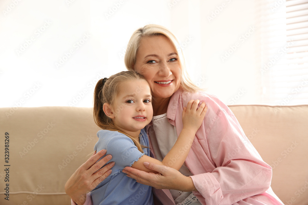 Mature woman with her little granddaughter at home Mature woman with her little granddaughter at home