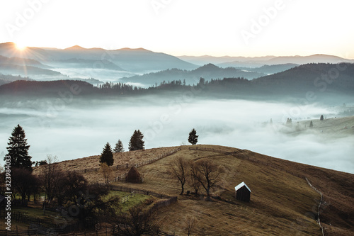 beautiful foggy autumn sunr...