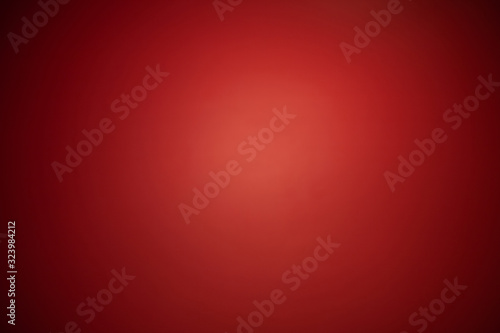 Abstract red spotlight background with dark vignettes. photo