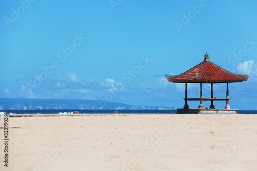 seascape background with bright sun and traditional tent on Bali island, Indonesia © night_cat