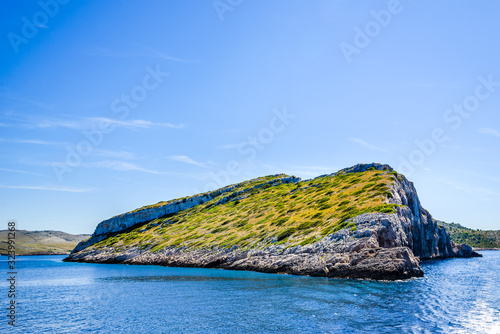 Beautiful seascape of Mediterranean Sea, landscape with rocky island in Croatia. Vacation travel destination.