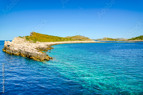 Fototapeta Naklejka Na Ścianę i Meble -  Beautiful seascape bay of Mediterranean Sea, scenic landscape with islands in the sea in Croatia with rocky beach. Vacation travel destination.