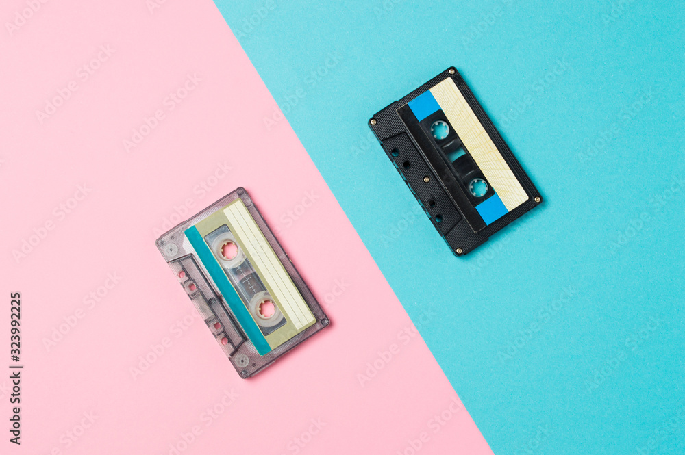 Fototapeta premium Retro audio cassette tapes on colorful background. Vintage music technology concept.